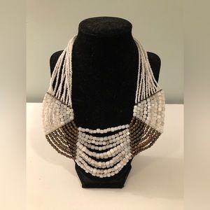 Bohemian layered white and gold beaded necklace.
